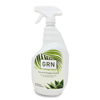 a white bottle of natural household cleaner with green and white labeling - by BLK+GRN