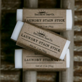 white laundry stain sticks mostly wrapped in brown paper packaging - by the brand LooHoo